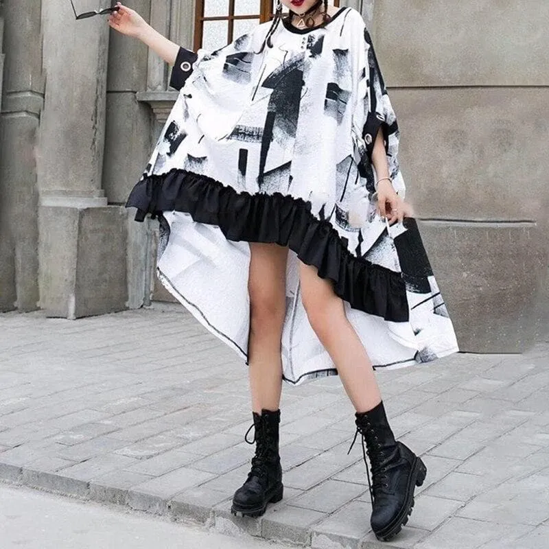 Cape-Like Dress With Ruffled Hem And Abstract Print